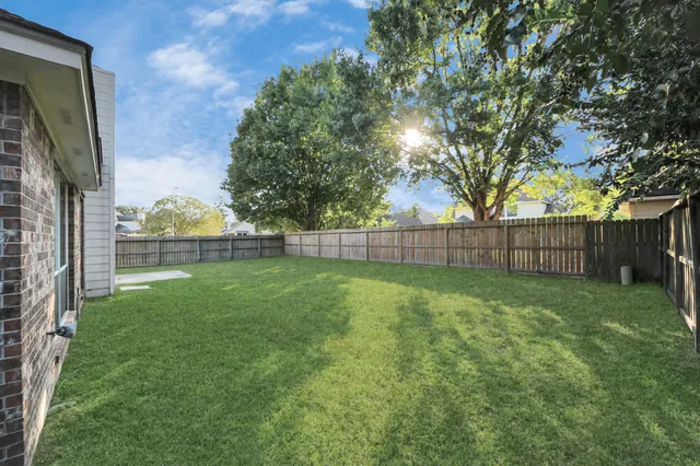 a view of a backyard with a trees