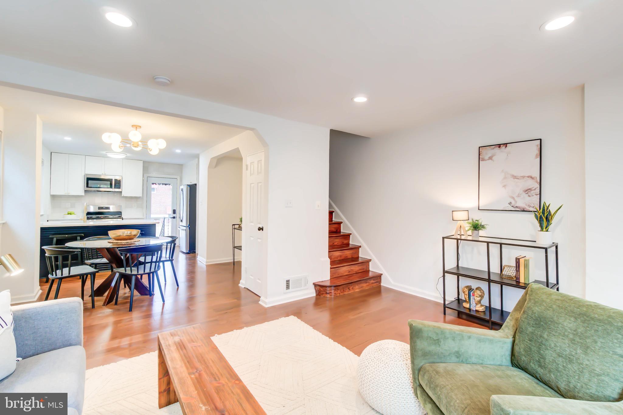 459 Riggs Road Northeast Washington, DC 20011 - Photo 14 of 57 a living room with furniture wooden floor and a dining table