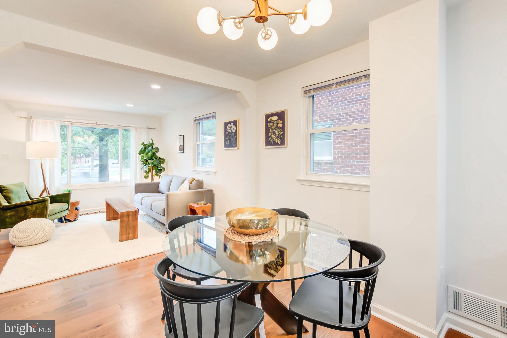 459 Riggs Road Northeast Washington, DC 20011 - Photo 16 of 57 a living room with furniture a chandelier and a window