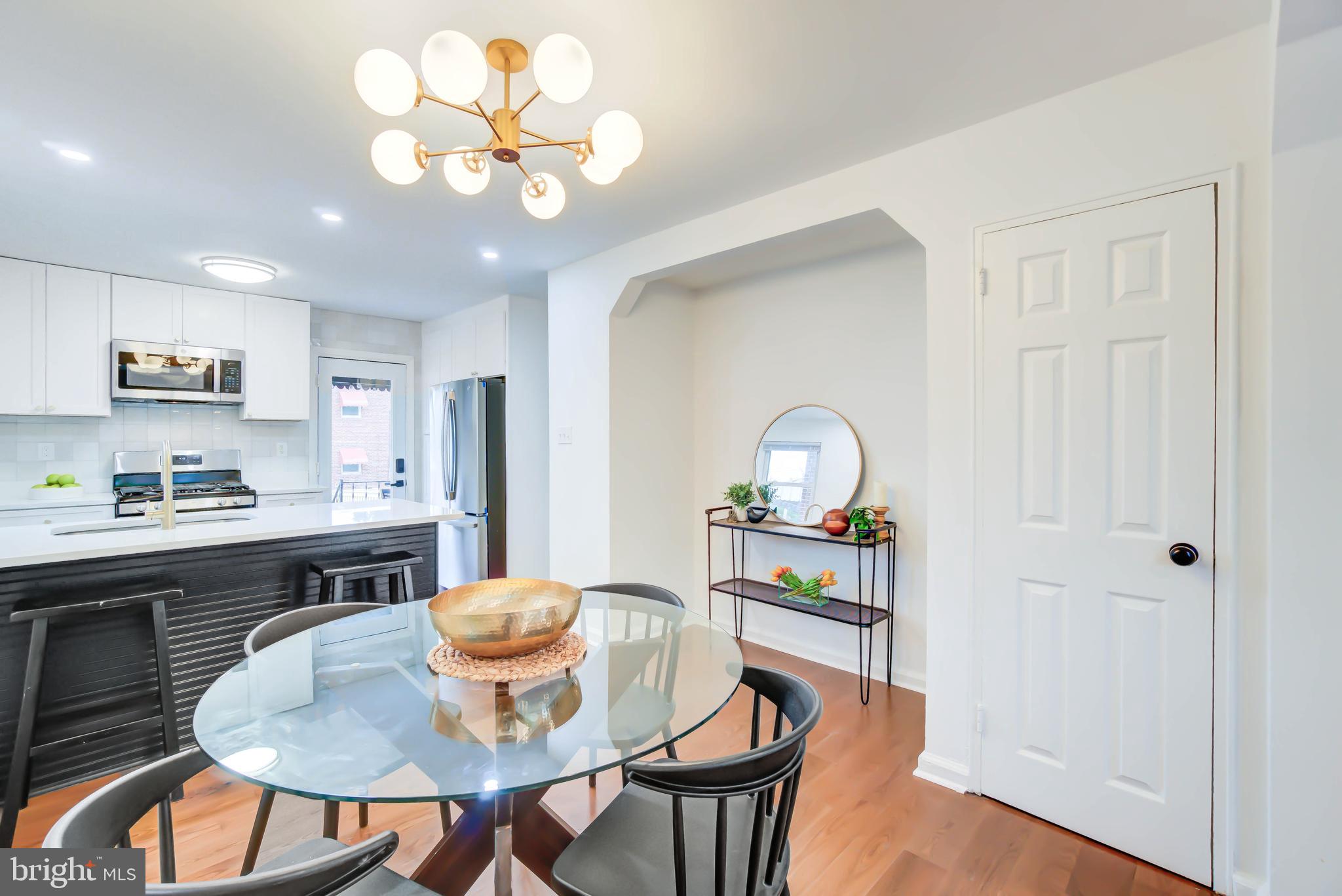 459 Riggs Road Northeast Washington, DC 20011 - Photo 17 of 57 a view of a dining room with furniture and wooden floor