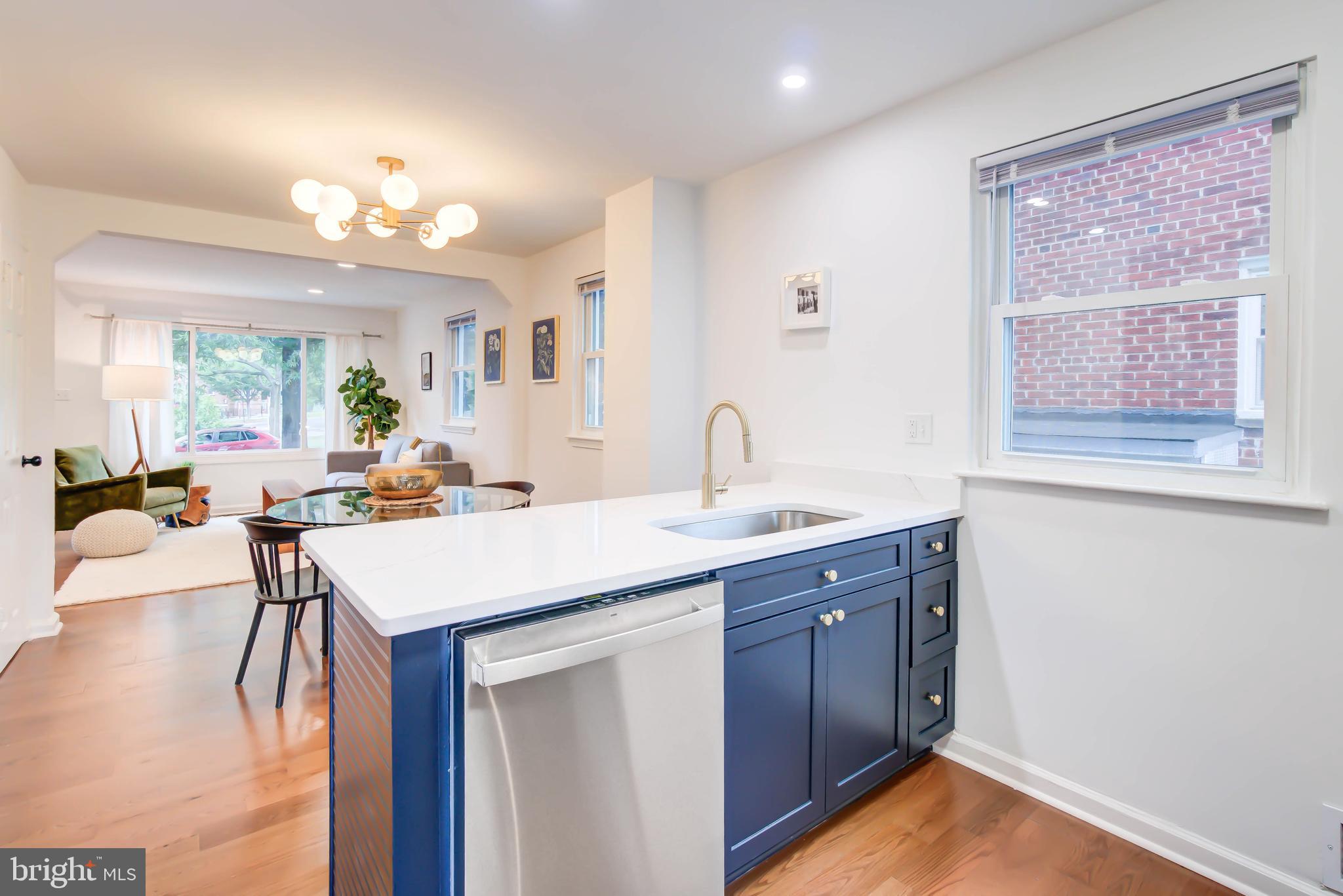 459 Riggs Road Northeast Washington, DC 20011 - Photo 20 of 57 a kitchen with a sink cabinets and wooden floor