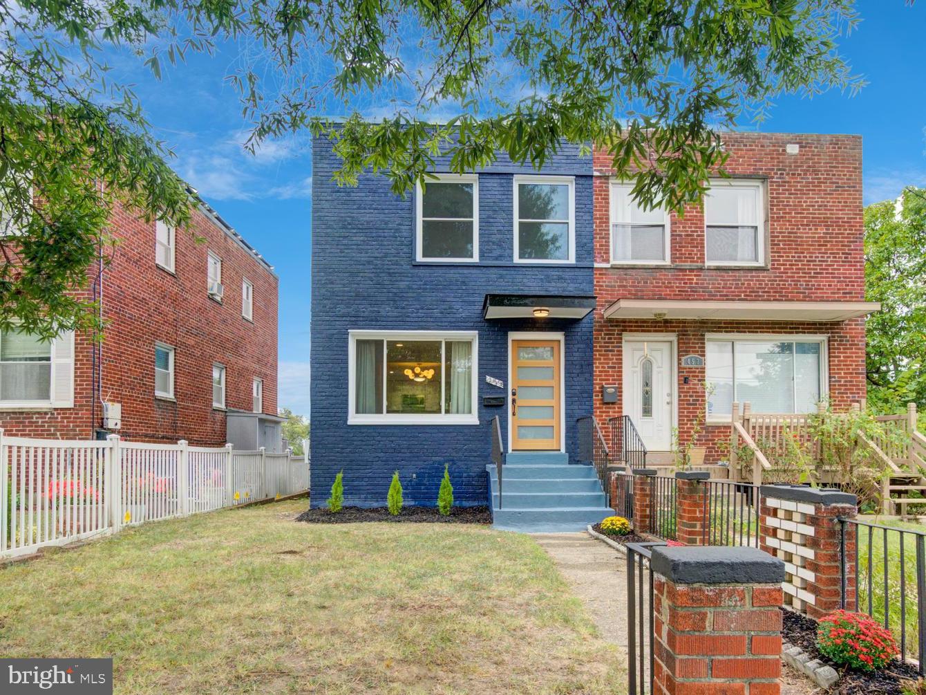 459 Riggs Road Northeast Washington, DC 20011 - Photo 2 of 57 a front view of a house with a yard