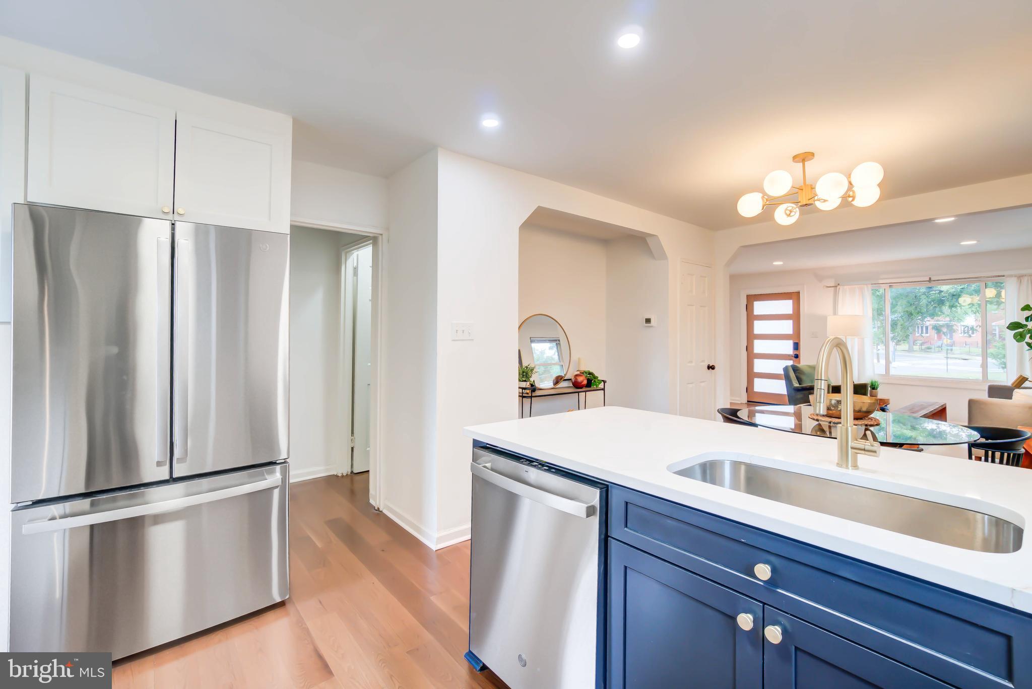 459 Riggs Road Northeast Washington, DC 20011 - Photo 23 of 57 a kitchen with stainless steel appliances a refrigerator and a sink