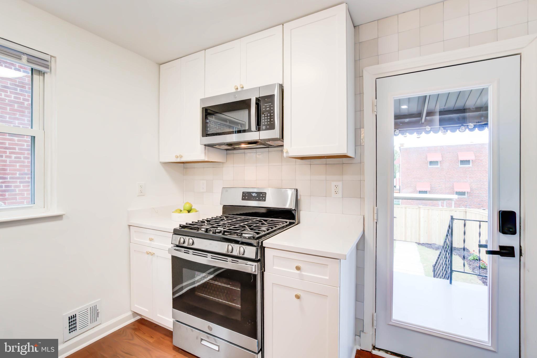 459 Riggs Road Northeast Washington, DC 20011 - Photo 24 of 57 Tile backsplash extends over backdoor