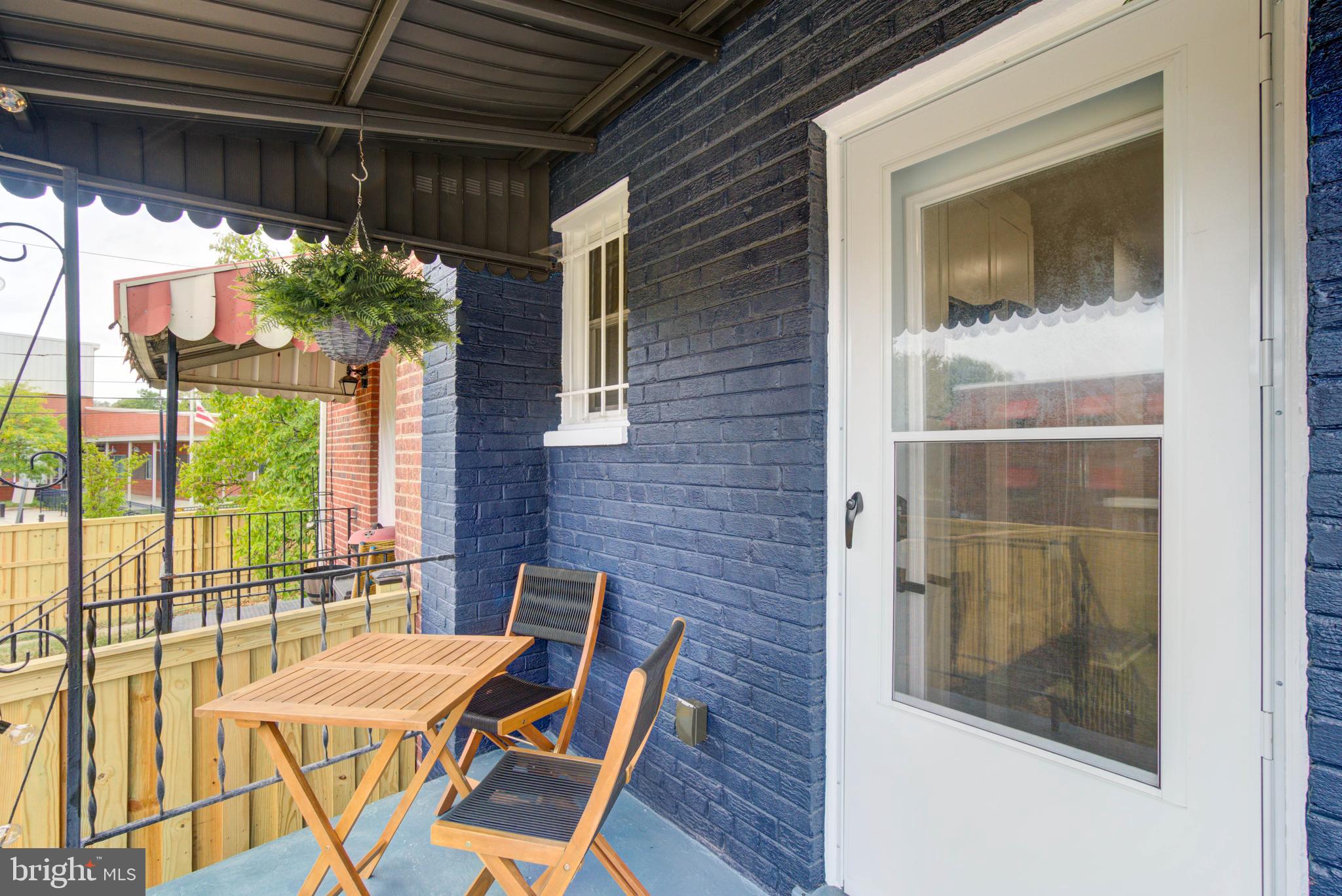 459 Riggs Road Northeast Washington, DC 20011 - Photo 25 of 57 a balcony with table and chairs