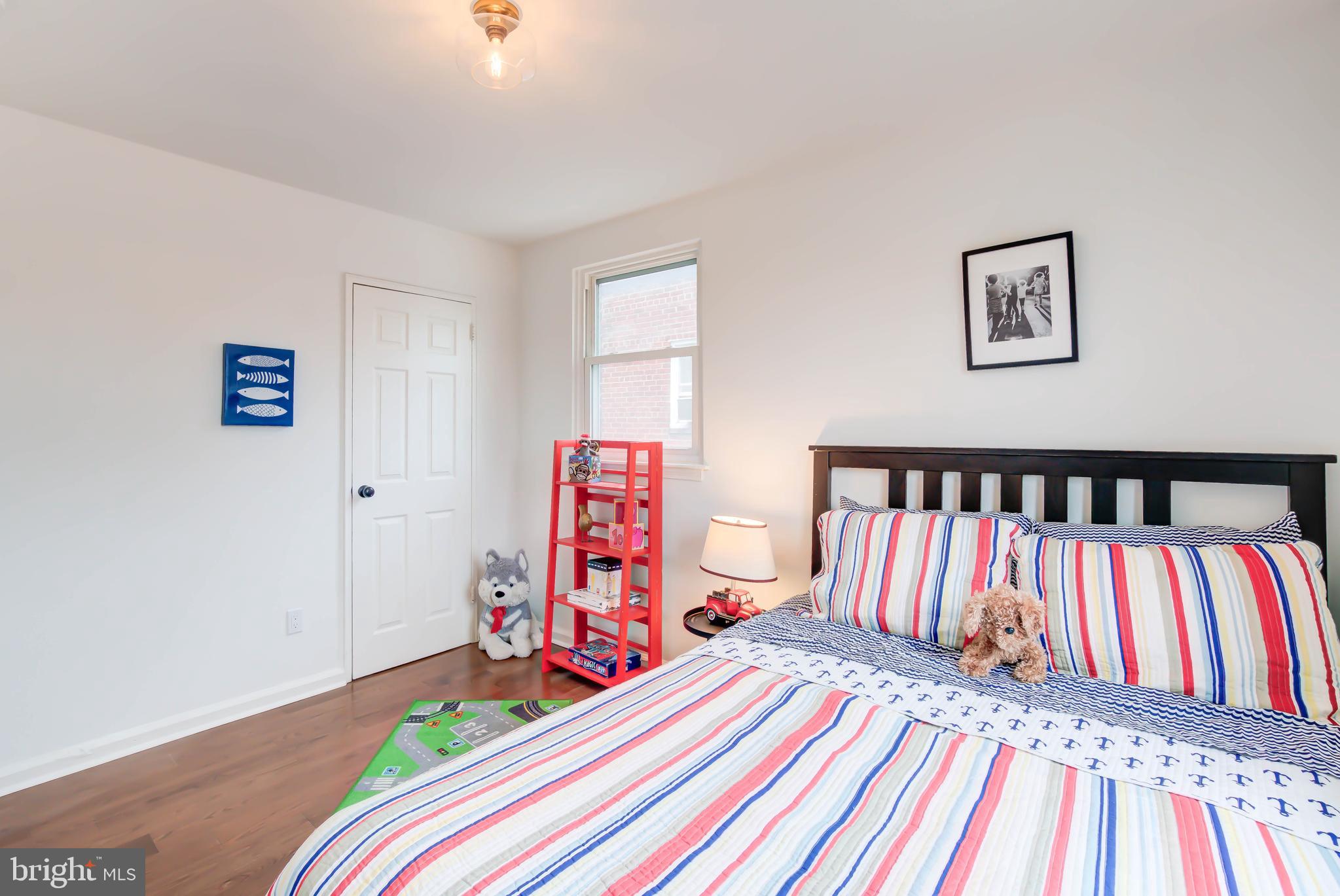 459 Riggs Road Northeast Washington, DC 20011 - Photo 32 of 57 a bedroom with bed and a book shelf