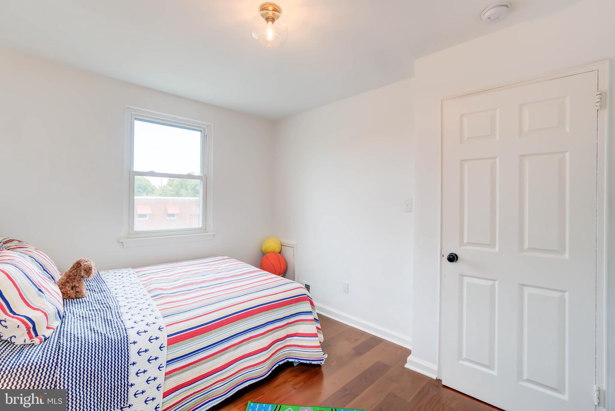 459 Riggs Road Northeast Washington, DC 20011 - Photo 33 of 57 a bedroom with a bed and a window
