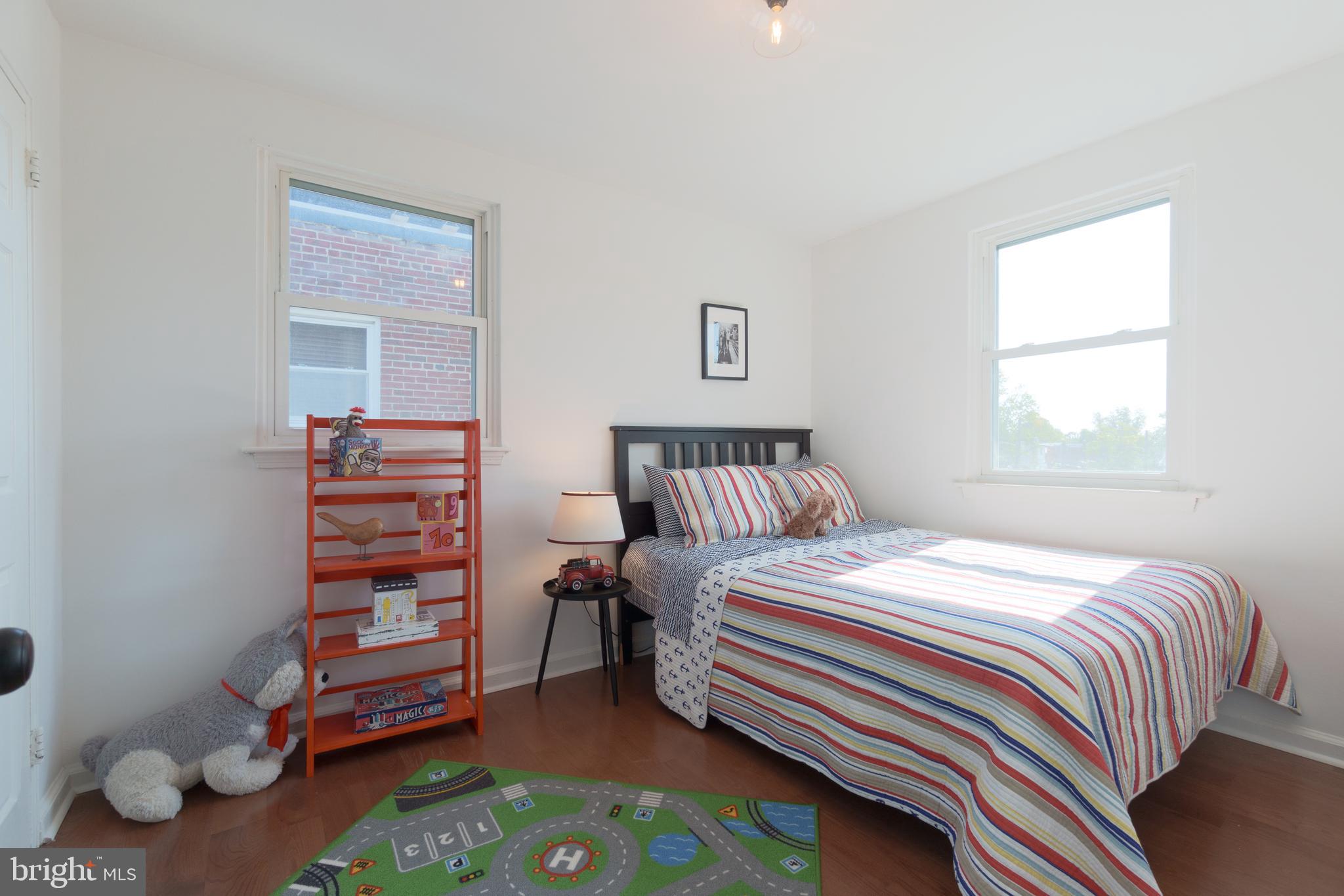 459 Riggs Road Northeast Washington, DC 20011 - Photo 34 of 57 a bedroom with a bed and a window