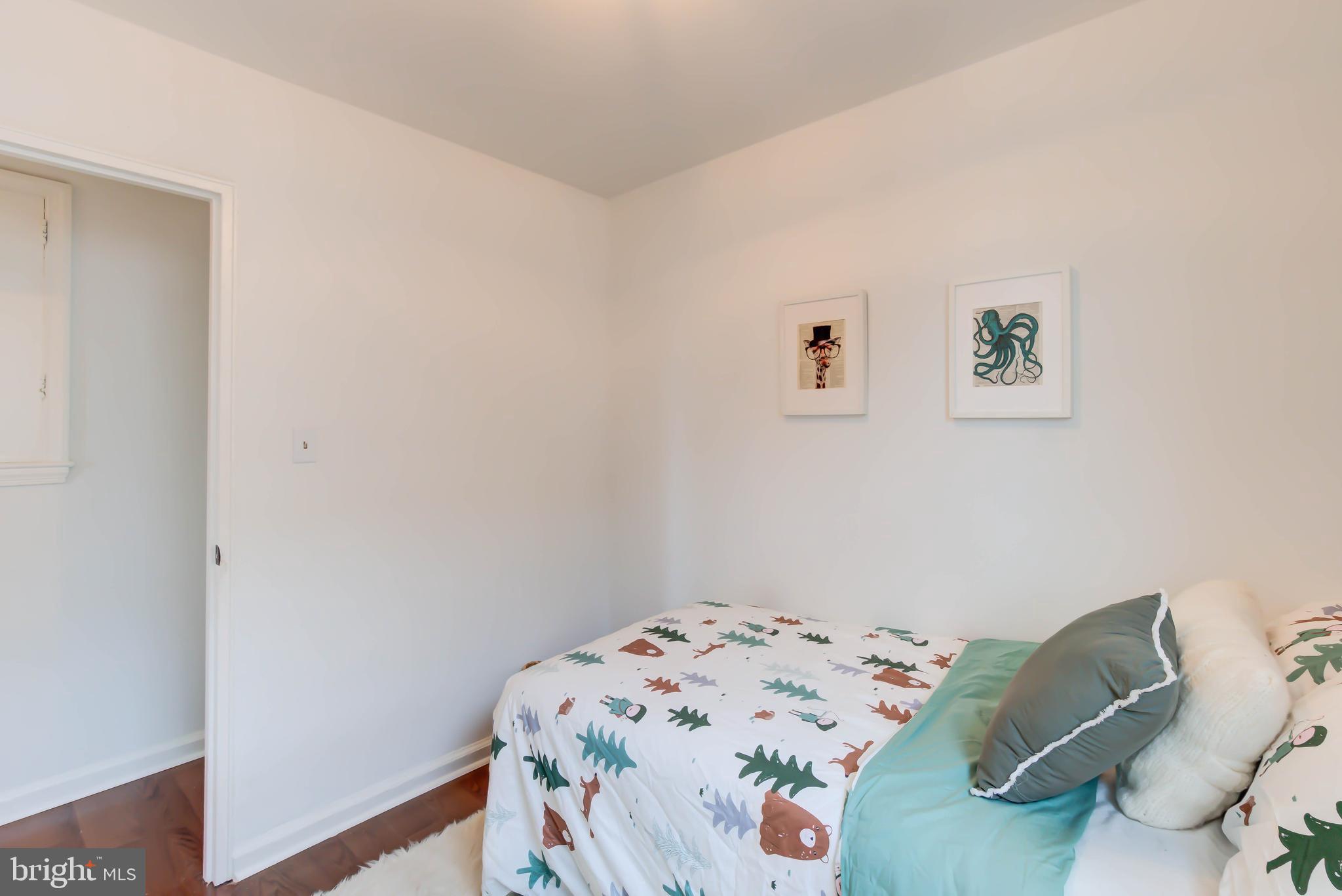 459 Riggs Road Northeast Washington, DC 20011 - Photo 37 of 57 a bedroom with a bed and a workspace