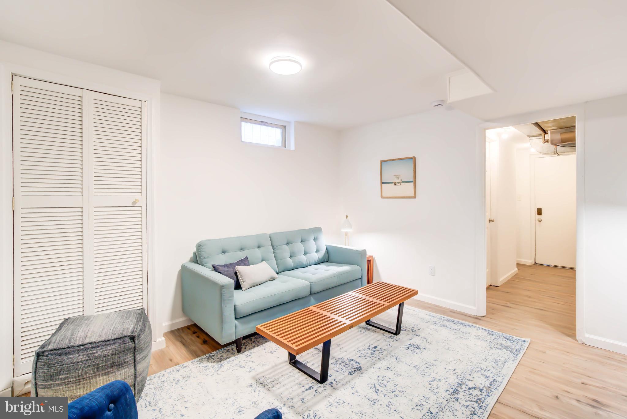 459 Riggs Road Northeast Washington, DC 20011 - Photo 38 of 57 a living room with furniture and a rug