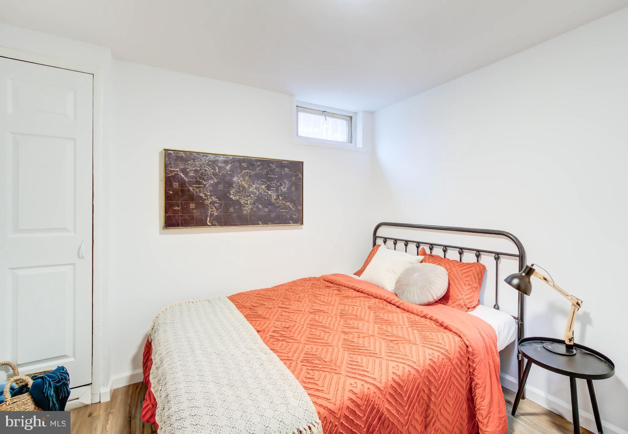 459 Riggs Road Northeast Washington, DC 20011 - Photo 41 of 57 a bedroom with a bed and a window