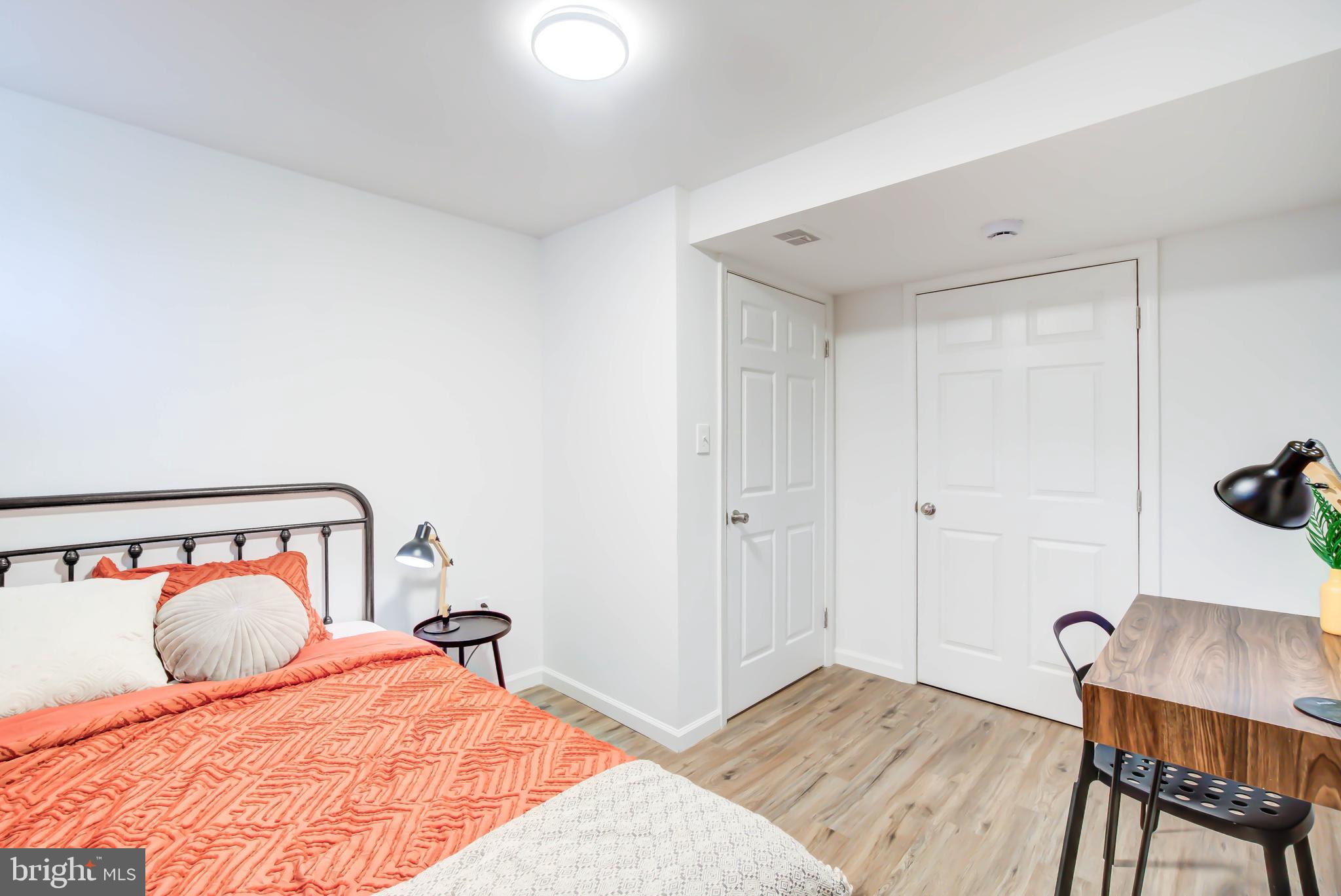459 Riggs Road Northeast Washington, DC 20011 - Photo 42 of 57 a bedroom with a bed and wooden floor