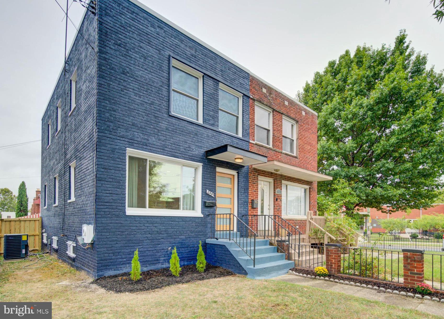 459 Riggs Road Northeast Washington, DC 20011 - Photo 49 of 57 a front view of a house with a yard