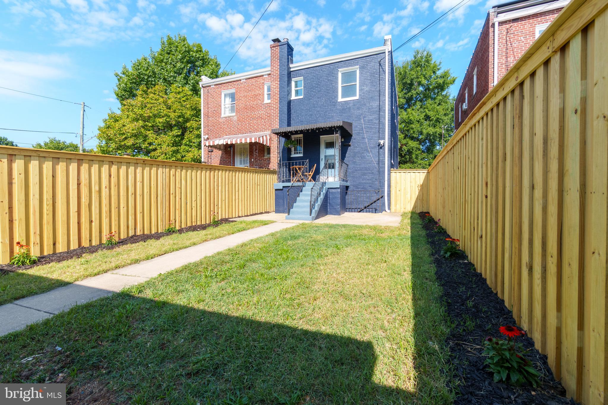 459 Riggs Road Northeast Washington, DC 20011 - Photo 5 of 57 a view of backyard with garden and flowers