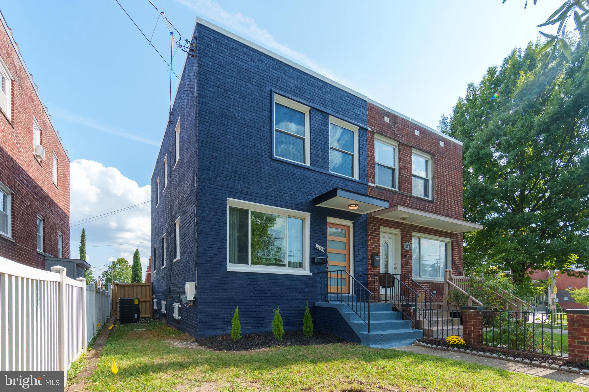 459 Riggs Road Northeast Washington, DC 20011 - Photo 57 of 57 a front view of a house with a yard table and chairs