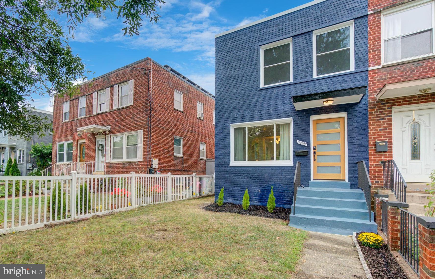 459 Riggs Road Northeast Washington, DC 20011 - Photo 7 of 57 a front view of a house having yard