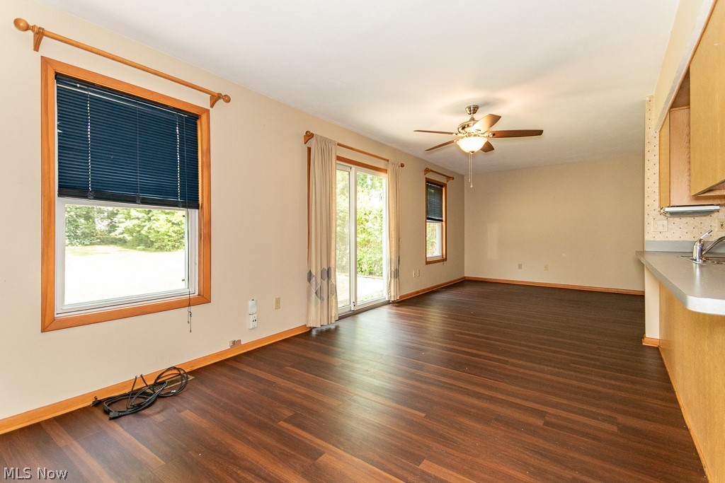 4517 Mackall Road Cleveland, OH 44121 - Photo 25 of 41 Unfurnished living room featuring sink, dark wood-type flooring, and ceiling fan