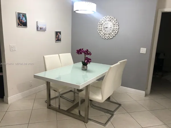 a view of a dining room that has a table and chairs