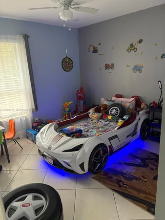 a bedroom with bed and a window