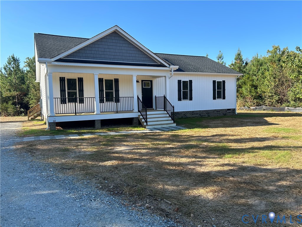 a view of a house with swimming pool next to a yard