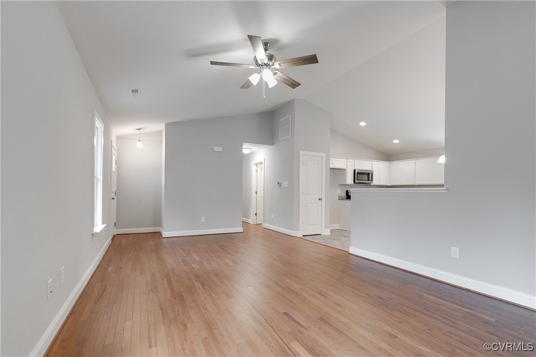 68 Halls Store Road Mineral, VA 23117 - Photo 5 of 30 an empty room with wooden floor and a ceiling fan