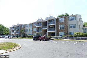 39 Mulberry Court Hamilton, NJ 08619 - Photo 2 of 24 a buildings with cars parked in front of it