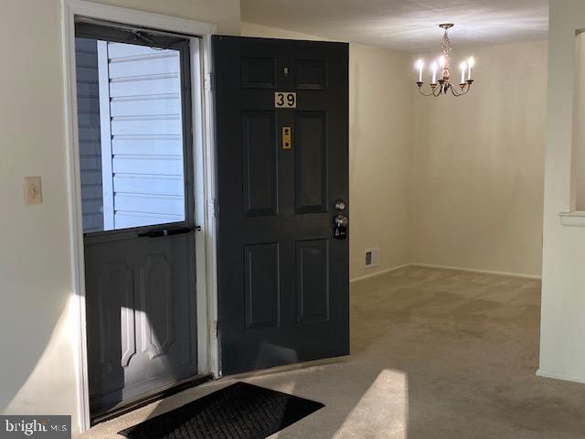 39 Mulberry Court Hamilton, NJ 08619 - Photo 3 of 24 a view of a hallway with a elevator