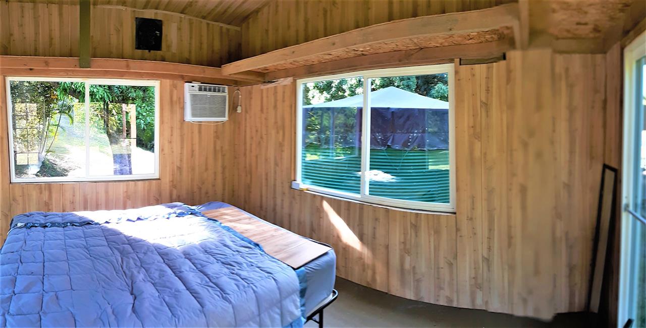 350 Hoolawa Road Haiku, HI 96708 - Photo 13 of 23 a bedroom with a bed and a window
