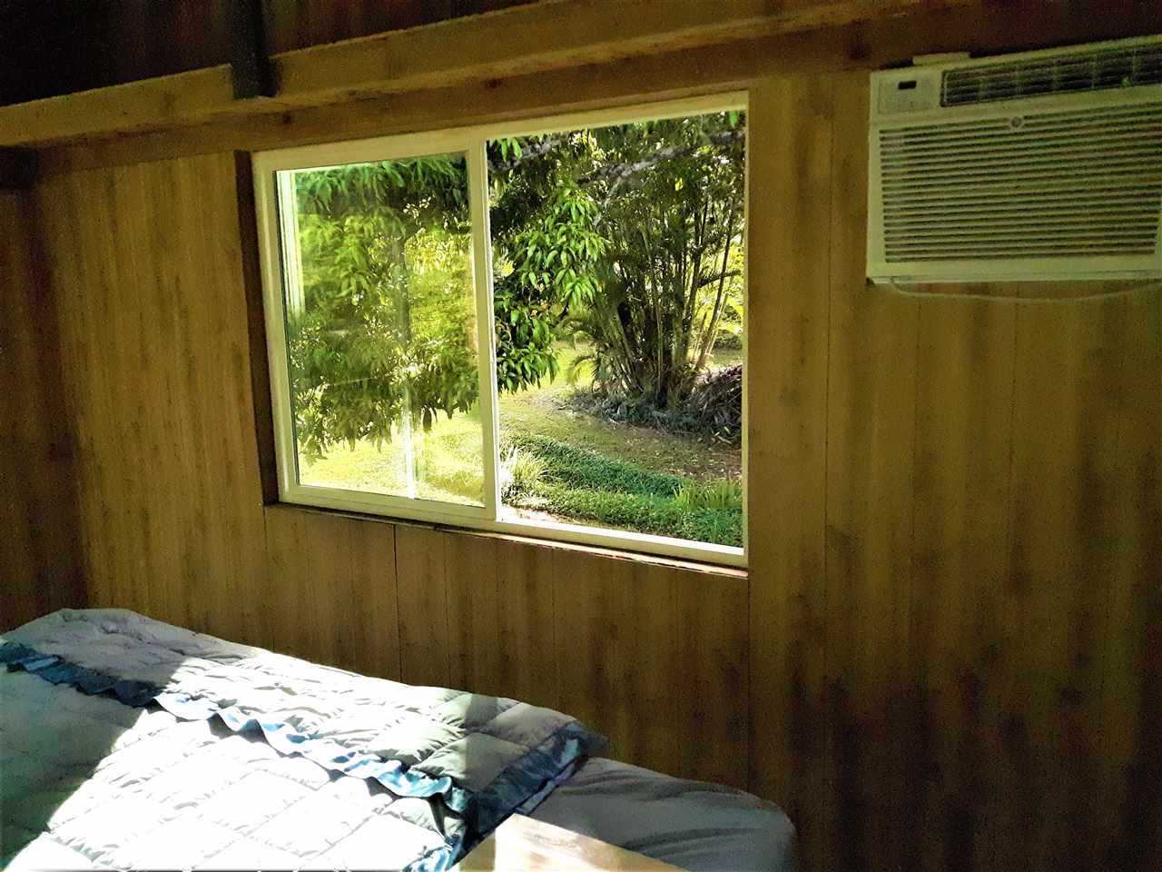 350 Hoolawa Road Haiku, HI 96708 - Photo 15 of 23 a bedroom with a bed and a window