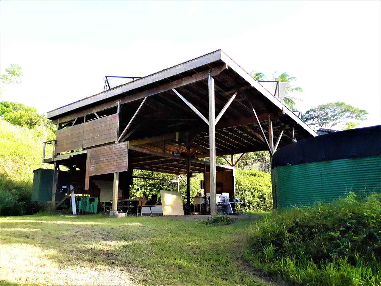 350 Hoolawa Road Haiku, HI 96708 - Photo 5 of 23 a front view of a house with a garden