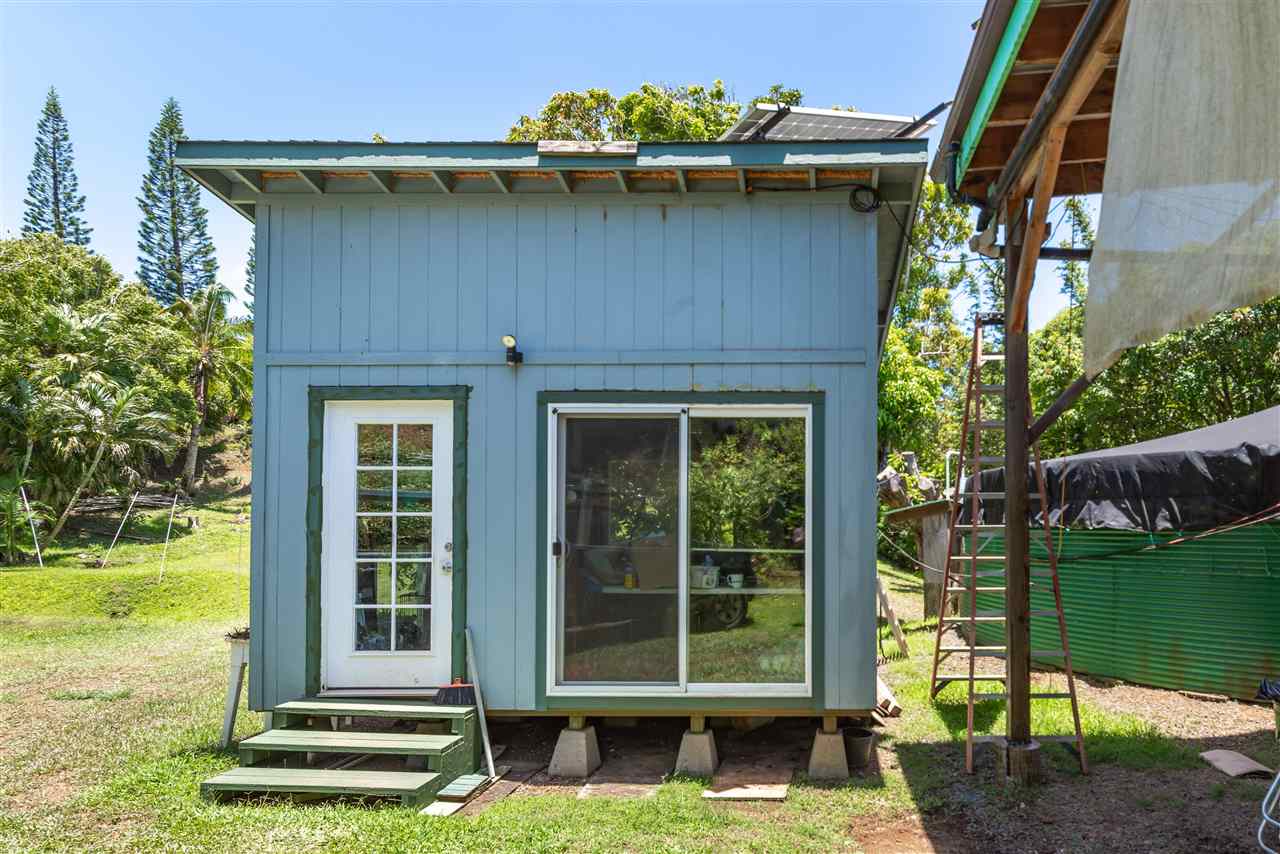 350 Hoolawa Road Haiku, HI 96708 - Photo 9 of 23 a view of a brick house with a yard