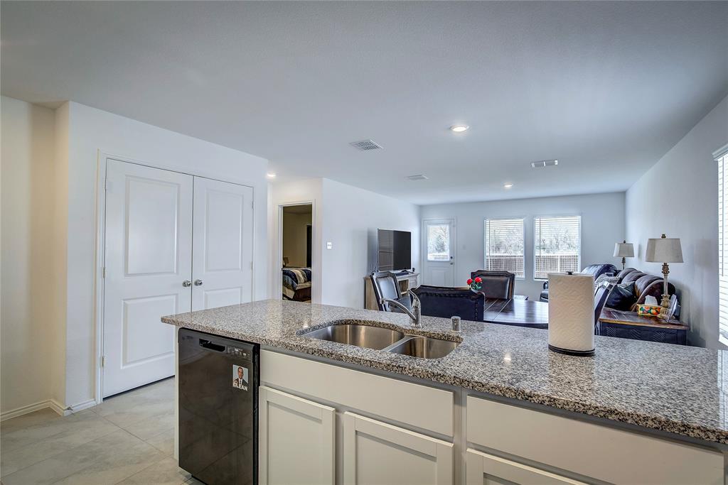 6000 Sumlin Way Princeton, TX 75407 - Photo 13 of 36 Kitchen View– Large island with breakfast bar overlooking living and dining areas.