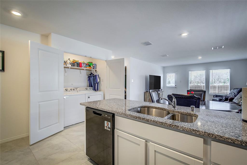 6000 Sumlin Way Princeton, TX 75407 - Photo 14 of 36 Kitchen View– Large island with breakfast bar overlooking living and dining areas.