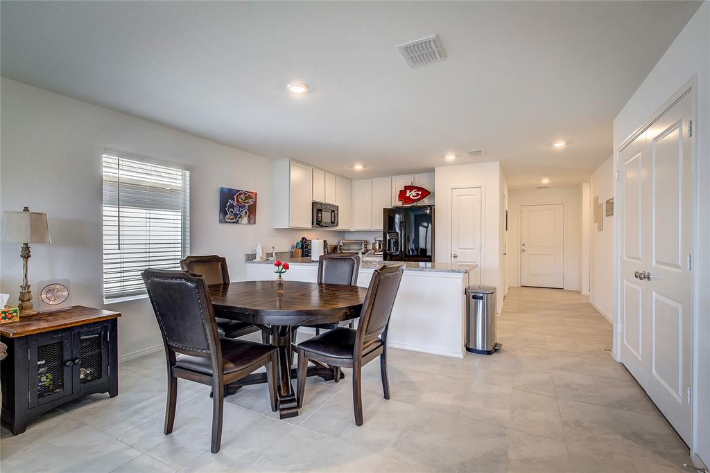6000 Sumlin Way Princeton, TX 75407 - Photo 17 of 36 Kitchen/Dining Angle – Seamless connection between kitchen and dining space.