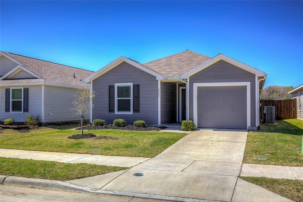 6000 Sumlin Way Princeton, TX 75407 - Photo 3 of 36 Front Exterior –Charming single-story home with clean landscaping, covered entry, and attached 1-car garage.