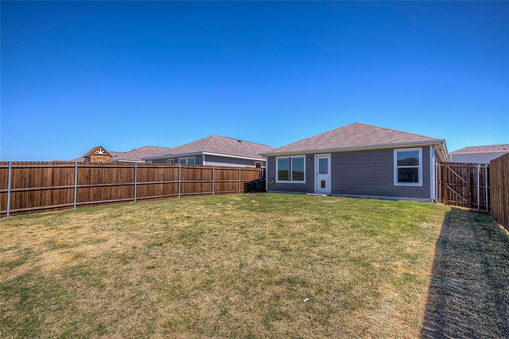 6000 Sumlin Way Princeton, TX 75407 - Photo 32 of 36 Backyard View– Additional angle showing privacy and open outdoor space.