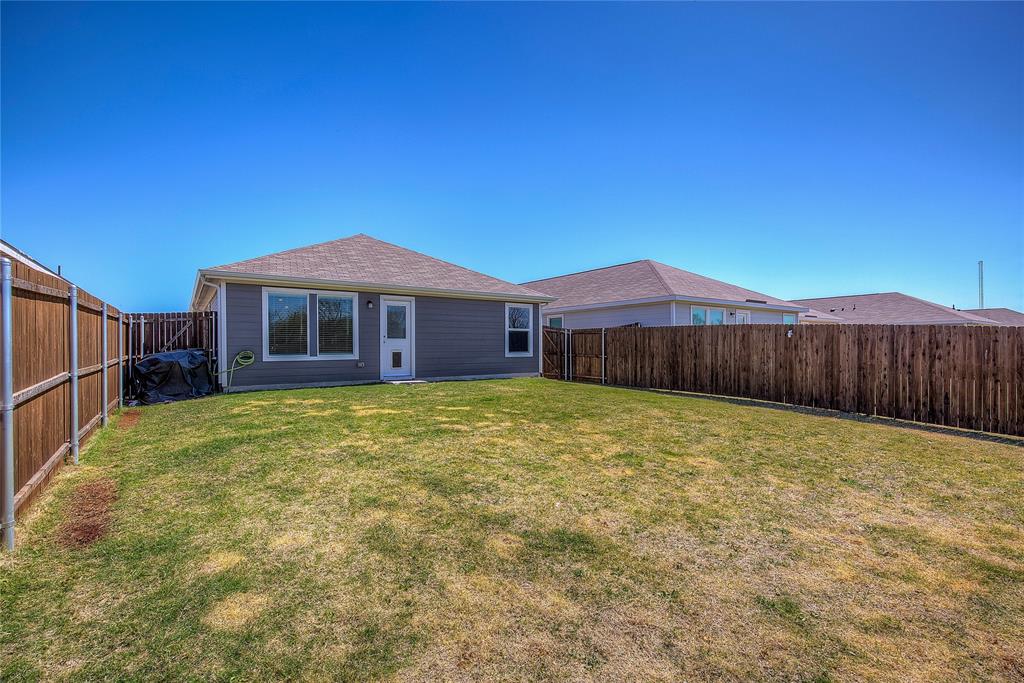 6000 Sumlin Way Princeton, TX 75407 - Photo 33 of 36 Backyard View– Additional angle showing privacy and open outdoor space.