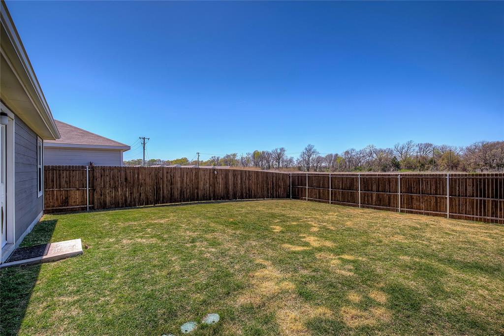 6000 Sumlin Way Princeton, TX 75407 - Photo 35 of 36 Backyard View– Large, fully fenced backyard with room to play or entertain.
