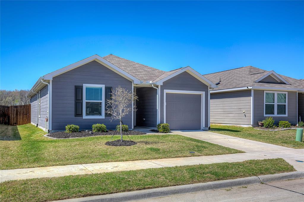6000 Sumlin Way Princeton, TX 75407 - Photo 4 of 36 Front Exterior –Charming single-story home with clean landscaping, covered entry, and attached 1-car garage.