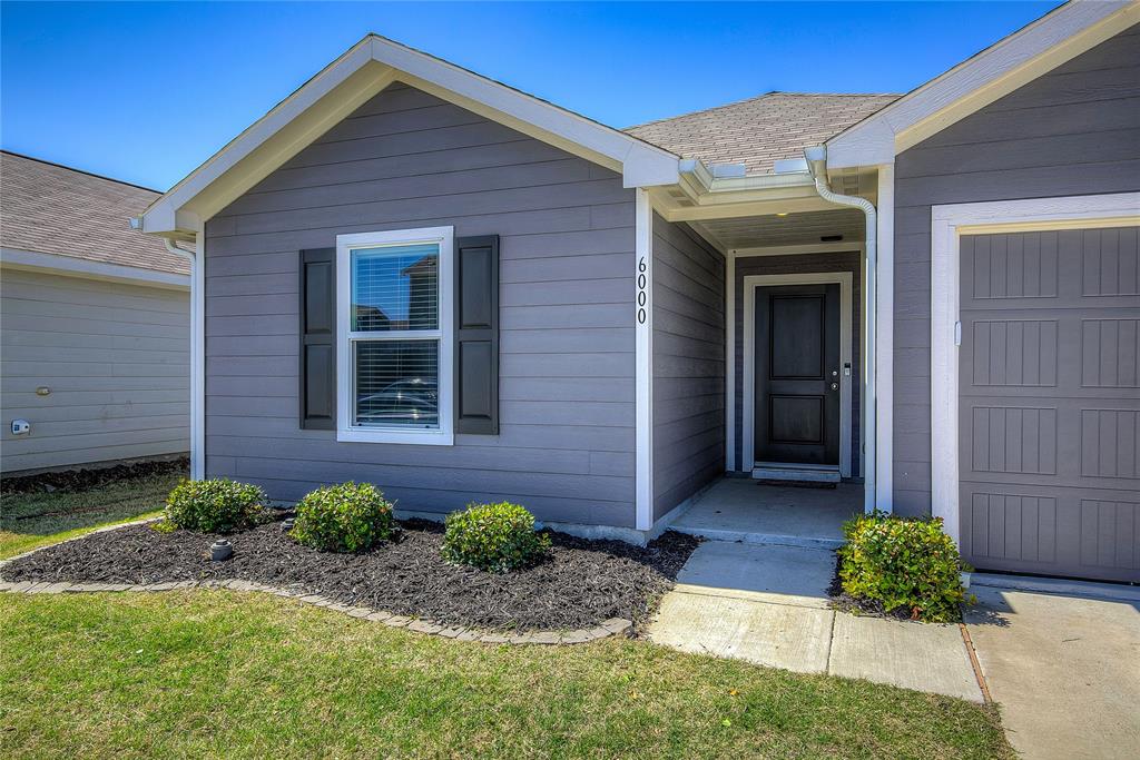6000 Sumlin Way Princeton, TX 75407 - Photo 5 of 36 Front Exterior –Charming single-story home with clean landscaping, covered entry, and attached 1-car garage.