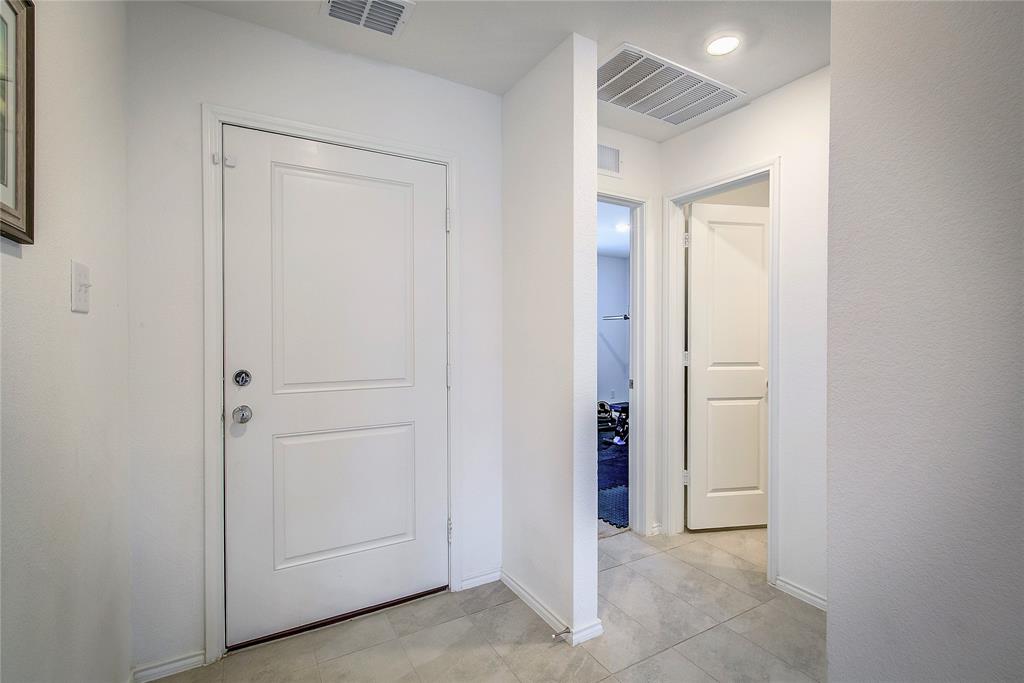 6000 Sumlin Way Princeton, TX 75407 - Photo 6 of 36 Entryway – Bright front entry with tile flooring and access to secondary rooms.