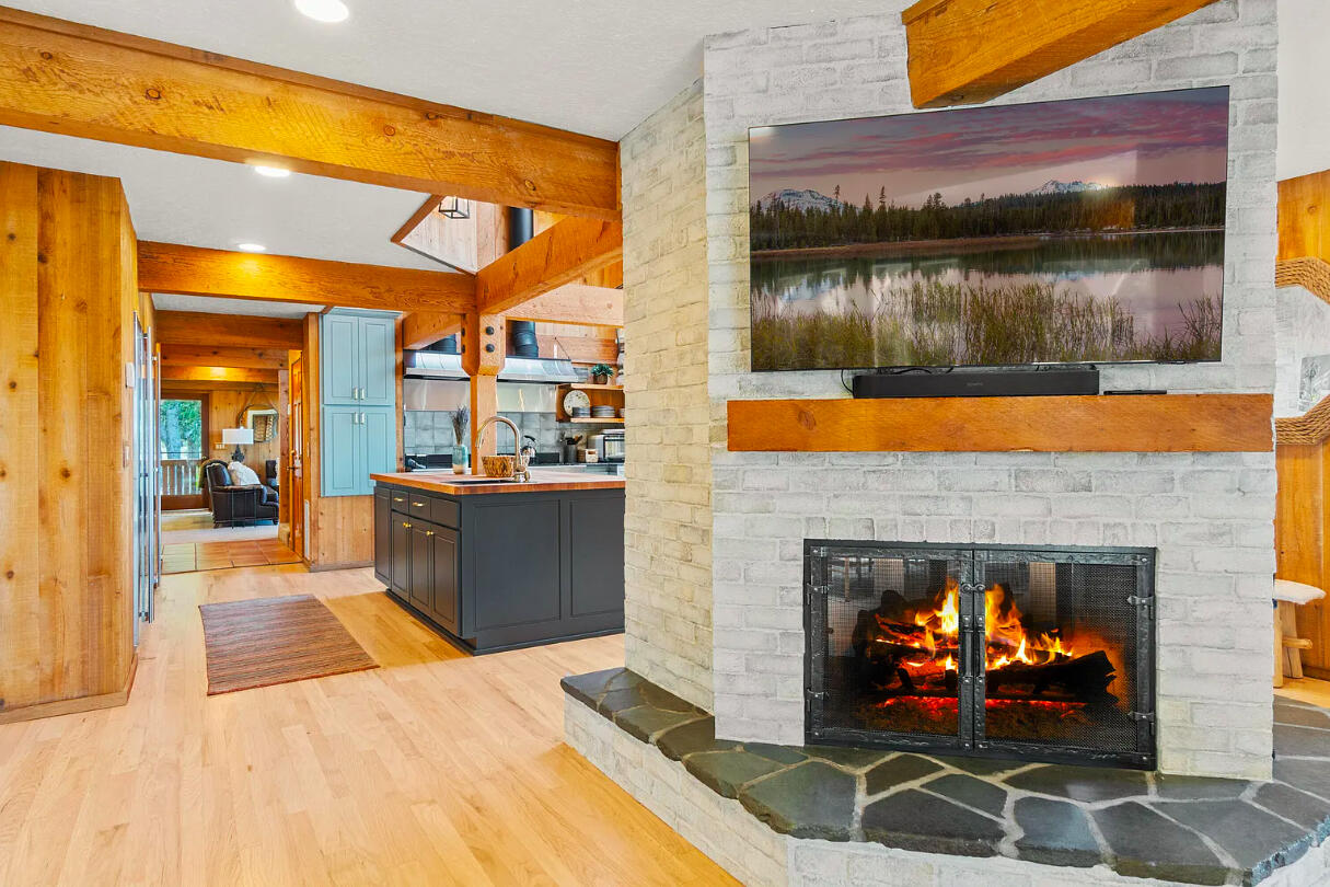60359 Arnold Market Road Bend, OR 97702 - Photo 23 of 64 double sided gas fireplace and tv lounge poolside