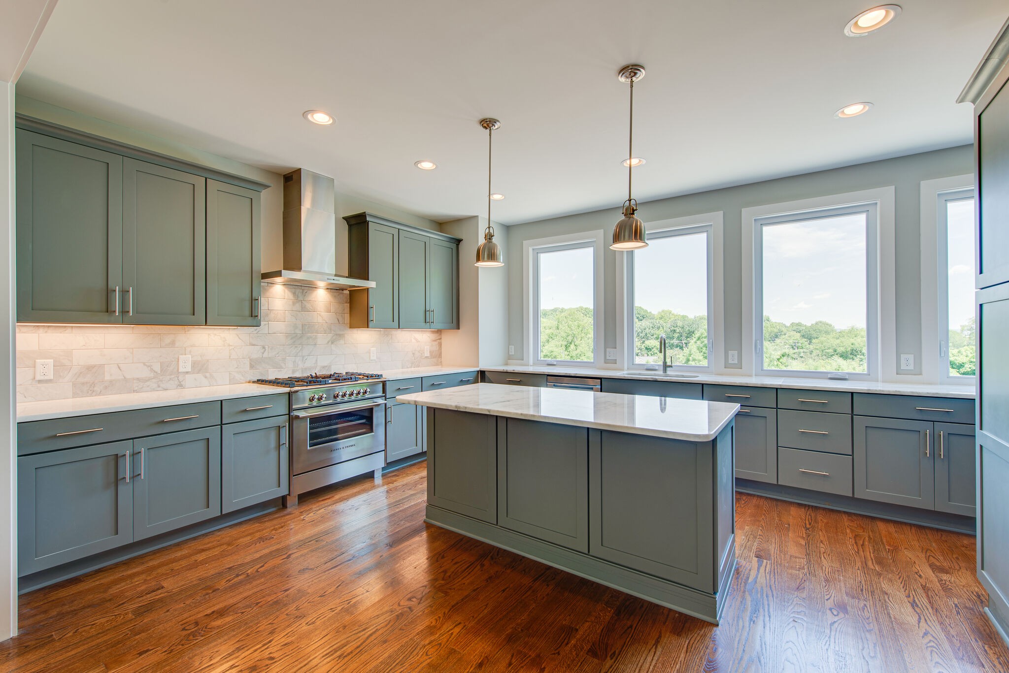119 Demoss Road Nashville, TN 37209 - Photo 11 of 38 a kitchen with granite countertop wooden floors and white appliances