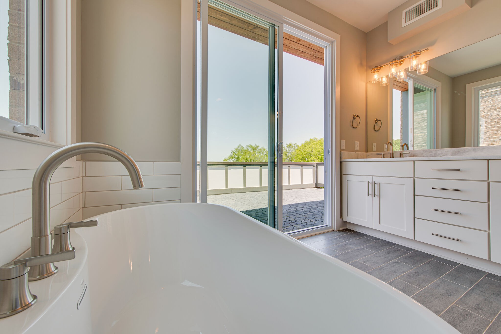 119 Demoss Road Nashville, TN 37209 - Photo 33 of 38 a spacious bedroom with a large bed and a large window