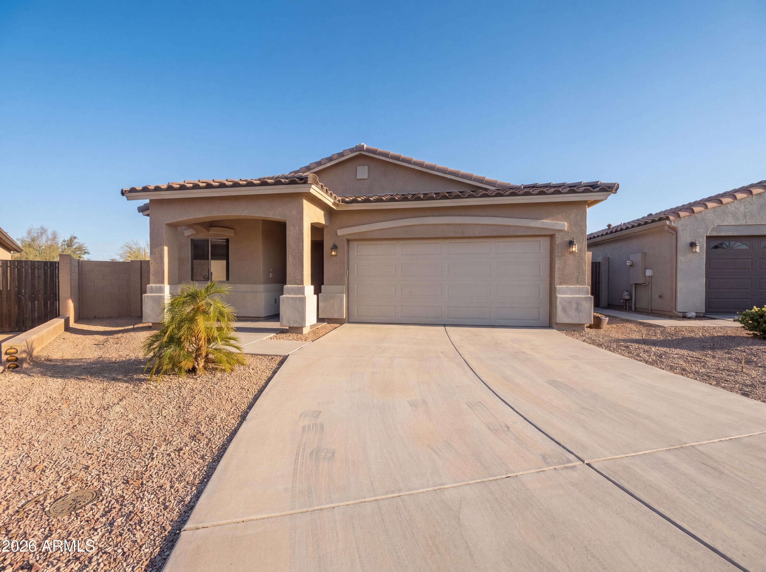 1738 South Aryelle Road Apache Junction, AZ 85119 - Photo 1 of 17 a front view of a house with a yard