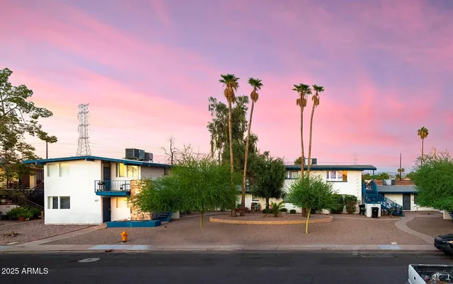 a street with a building in the background