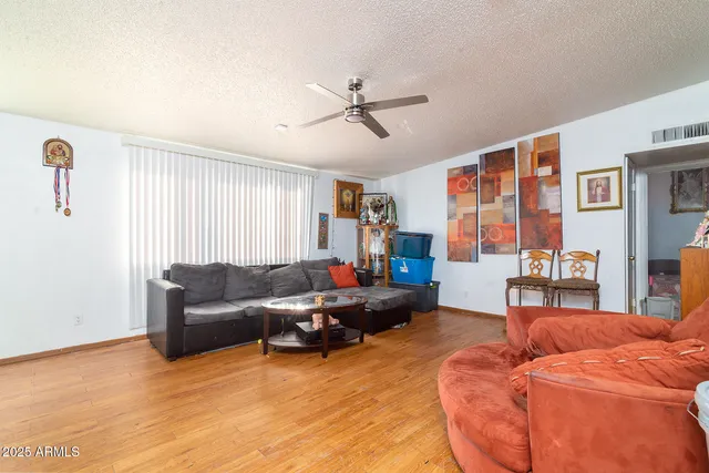 an aerial view of a house with outdoor seating