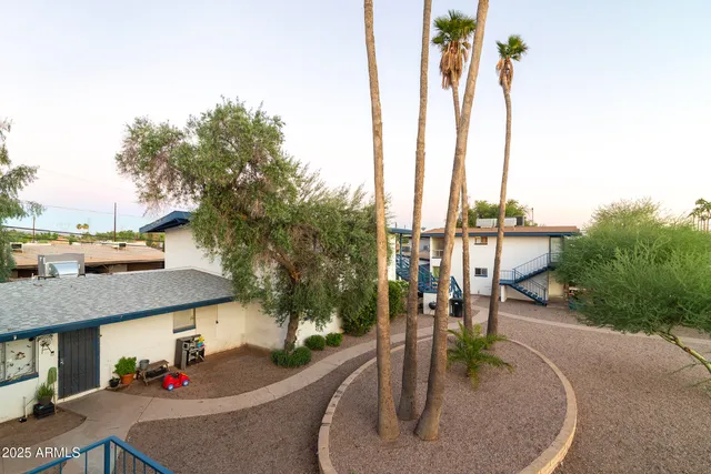 a kitchen with stainless steel appliances a refrigerator sink and cabinets