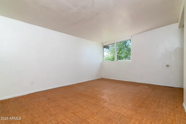 a view of an empty room with a window