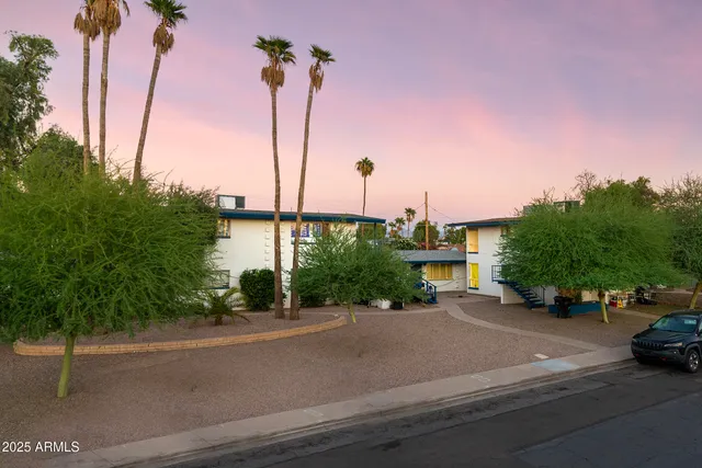 a swimming pool with outdoor seating